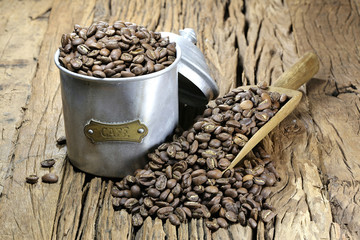vintage French coffee can with manufacture roasted Indonesian Arabica coffee beans on rustic wooden background