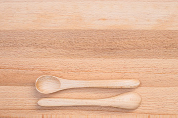 Wooden spoon on wooden background