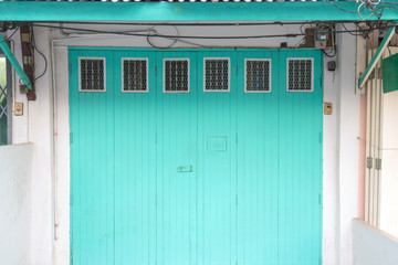 The old beautiful blue front door and white walls.