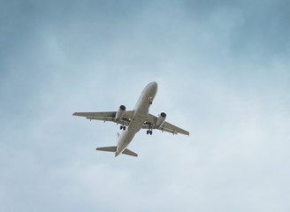 Fototapeta na wymiar Airplane on blue sky