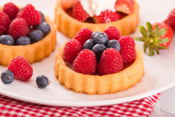 Tartlets with forest fruits. 