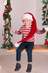 A boy on a swing in the new year  has fun