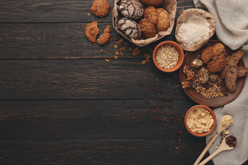 Oatmeal cookies and baking ingredients for homemade pastry background