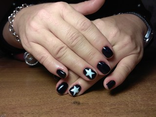 The manicurist excellently made her work a beautiful manicure with a polish gel on her hands and...