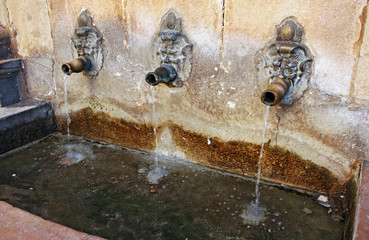 Old fountain with pipes