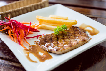 Steak french fries and salad
