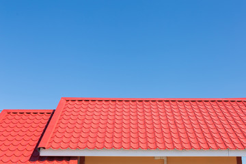 Red roof with blue sky background