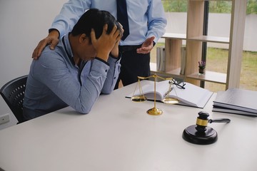 Legal counsel presents to the client a signed contract with gavel and legal law. justice and lawyer concept