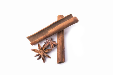 Cinnamon sticks and anise stars isolated on white background