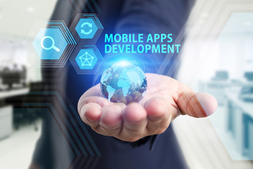 The concept of business, technology, the Internet and the network. A young entrepreneur working on a virtual screen of the future and sees the inscription: Mobile apps development