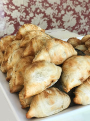 Curry puff pastry on white plate