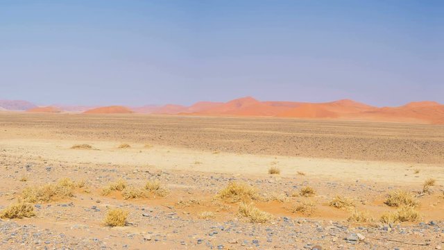 Panorama on colorful sand dunes and scenic landscape at Sossusvlei in the Namib desert, Namib Naukluft National Park, tourist destination in Namibia. Travel adventures in Africa.