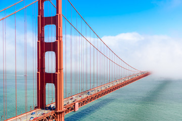 Golden Gate Bridge in clouds on a beautiful summer day  - Panoramic view from Battery Spencer -...