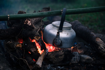 boiling a water for make coffee in a campfire