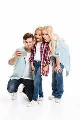 Fototapeta premium Full length portrait of a cheerful young family