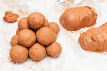 In the pottery workshop. Red clay, prepared for students