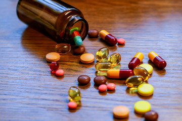 Tablets and capsules are poured from the bottle