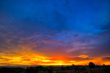 Natural Sunset Sunrise Over Field Or Meadow.