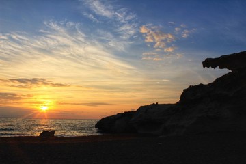 Fototapeta na wymiar Sunrise on the beach and fossil dune silhouette