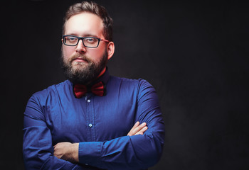 A man in eyeglasses and bow tie.