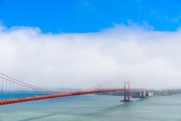 Golden Gate Bridge in clouds on a beautiful summer day  - Panoramic view from Battery Spencer - California, USA