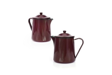 Vintage metallic enameled coffee pot on a white background