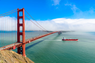 Golden Gate Bridge in clouds on a beautiful summer day  - Panoramic view from Battery Spencer - California, USA
