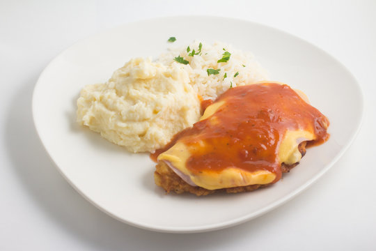 Chicken Fillet with rice and Mushed Potatoes. Parmegiana Fillet