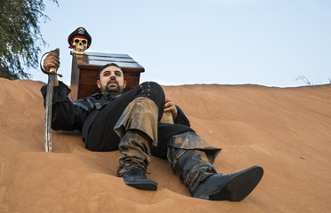 black pirate in a desert with treasure box