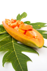 Fresh papaya sliced in papaya. White background. Tropical fruit.