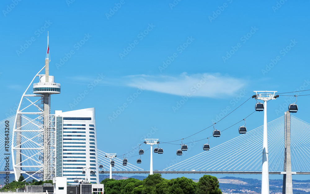 Wall mural cable car and vasco da gama tower in lisbon.