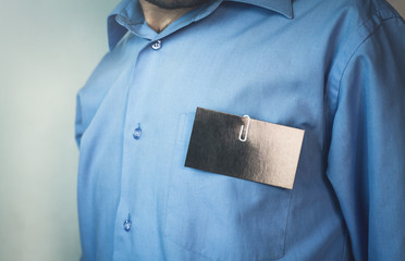 Businessman with a blank business card.