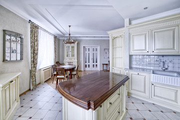 Modern design white kitchen in a spacious apartment.