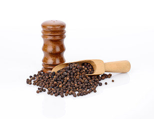 Black pepper on white background.
