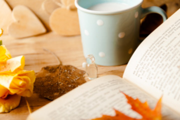 Autumn composition with cup coffee