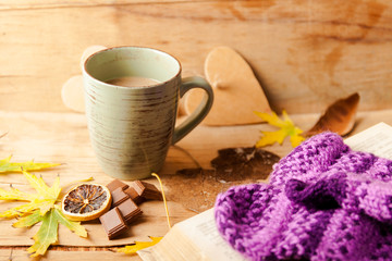 Autumn composition with cup coffee