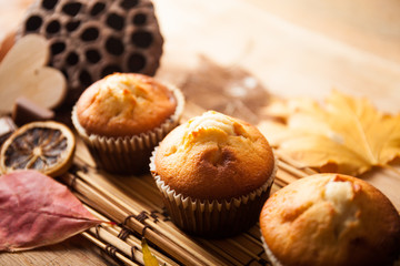 Fresh muffin close up on wood desk