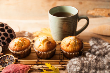 Fresh muffin close up on wood desk