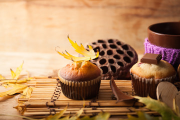 Fresh muffin close up on wood desk
