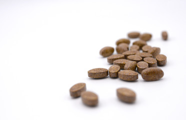 Group of dark red brown oval shape organic vitamins
