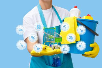 Cleaning lady shows the shopping cart and icons of features .
