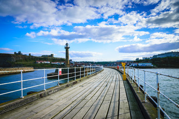 Fototapeta na wymiar Whitby pier at the harbor entrance at Whitby in North Yorkshire, UK