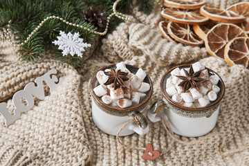 Two cups of hot drink with marshmallow and Christmas decor. A symbol of love and Christmas. Close...