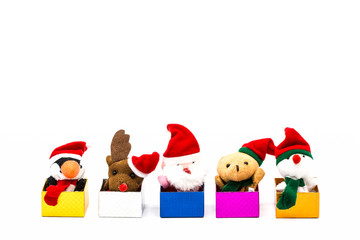 Merry christmas and happy new year 2018. greeting card with copy-space. Santa Claus doll,Reindeer doll,Penguin dall,Teddy bear and Snowman on Christmas decorations box on white background.