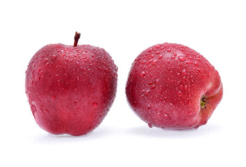 Red Apple with drops of water on white background