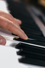Fototapeta na wymiar Man's hands playing the Piano