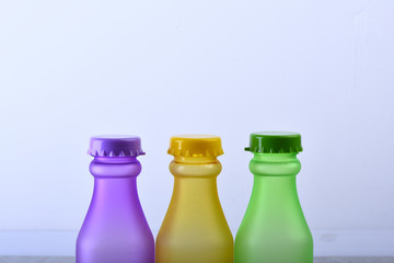 Rainbow composition and beverage concept. Row of colorful soft drinks