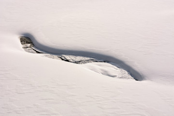fancy snow layout on the shore of brook. beautiful and unusual background