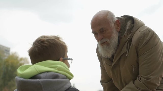 Grandfather scolds a grandson