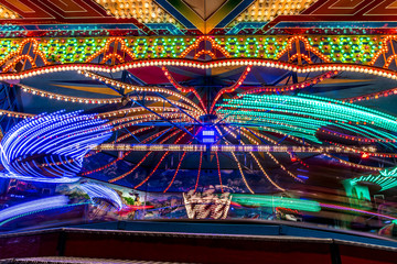 Moving colors of a carrousel at a funfair